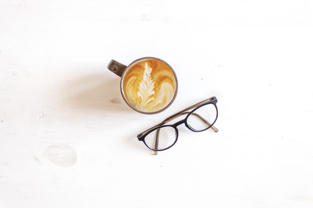 a delicious cup of coffee and a pair of glasses: positive visualisation